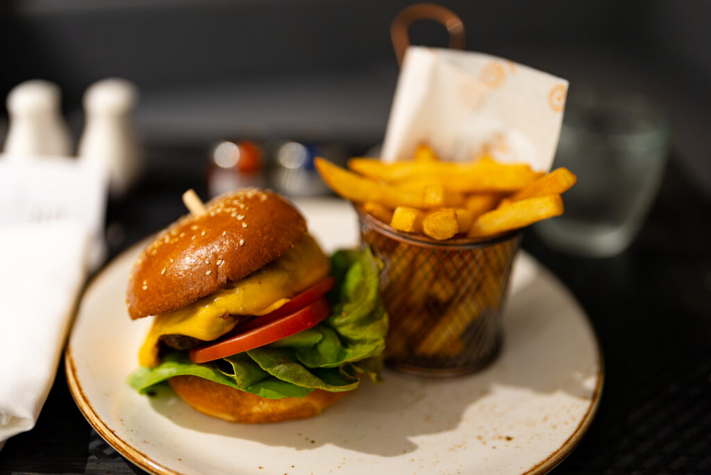 A juicy beef burger with smoked cheddar and chips perfect for a mid-night snack. Photo: Harmeet Sehgal