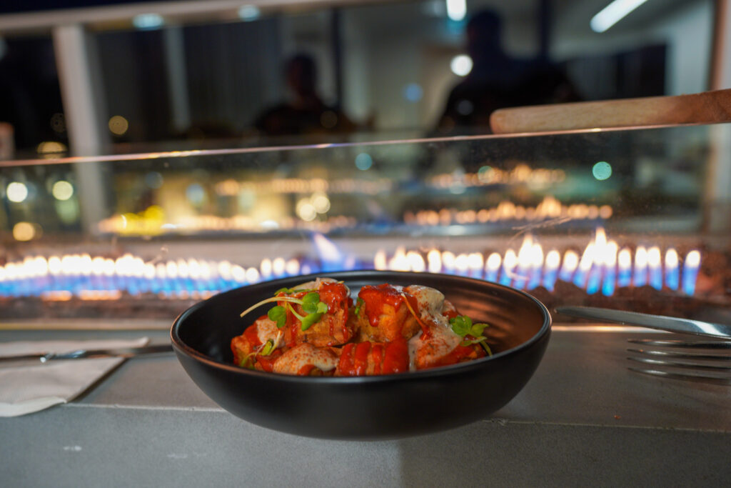 Patatas Bravas: Aioli, black garlic & lime crema